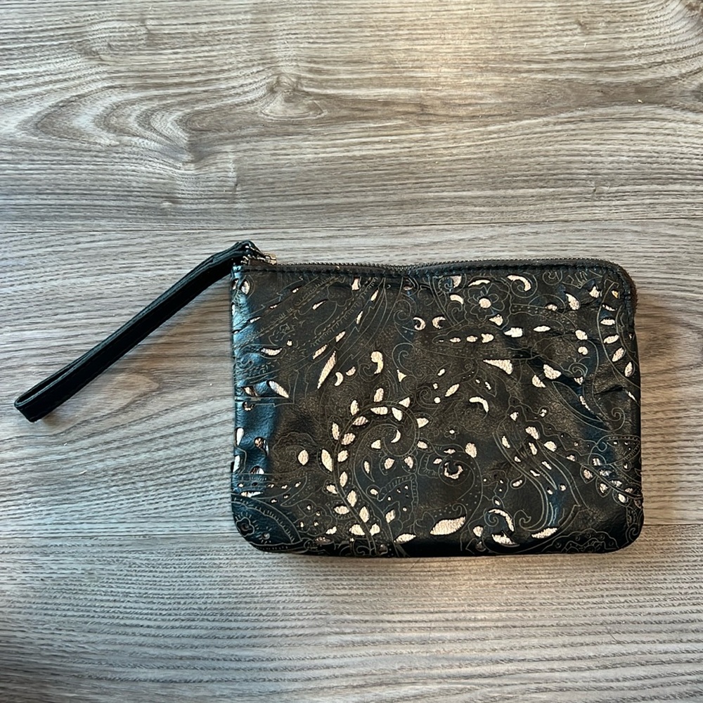 Patricia Nash Italian Leather wristlet black with metallic cutouts.